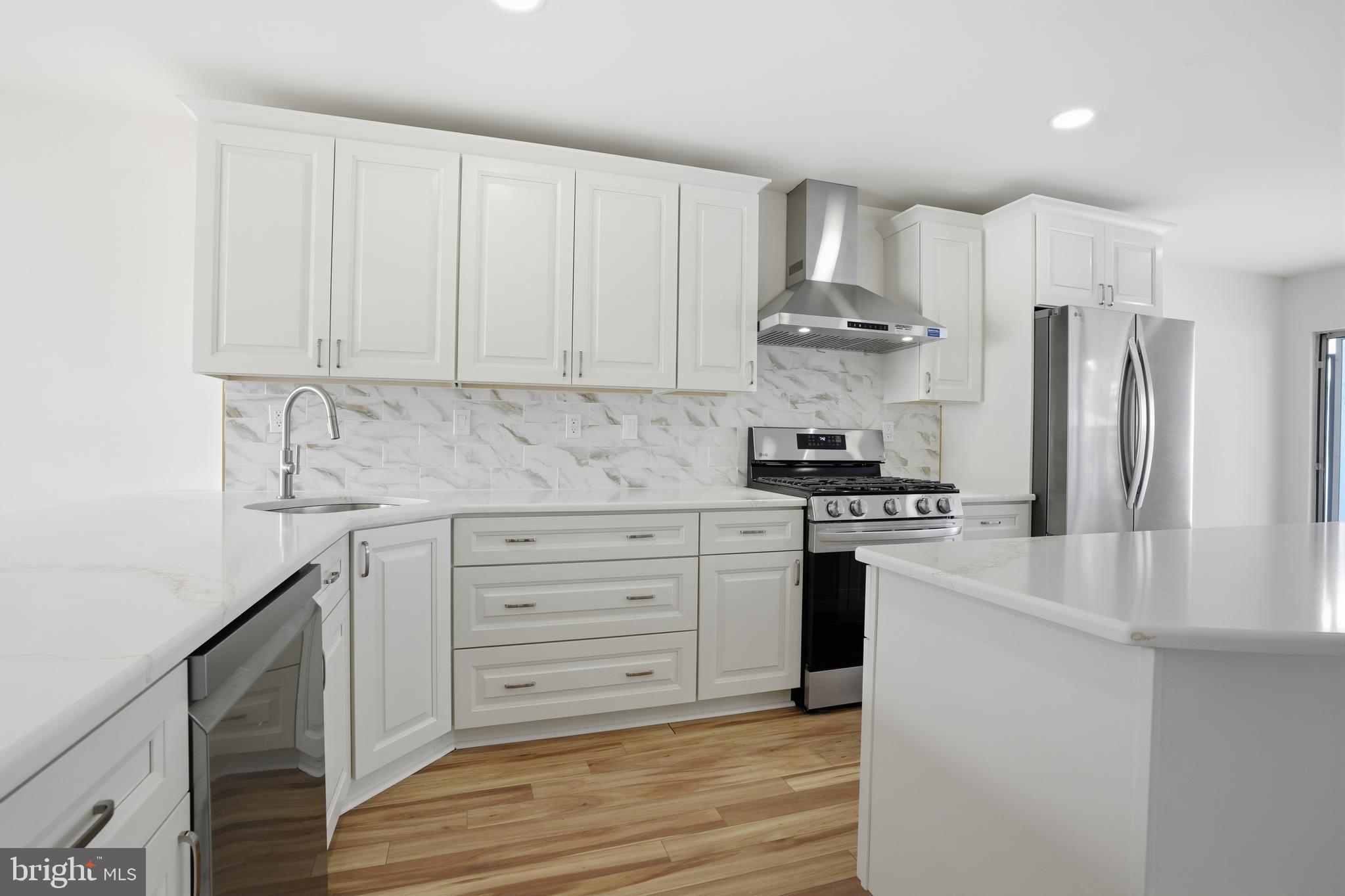 1004 Waterford Road Yardley, PA 19067 - Photo 11 of 27 a kitchen with stainless steel appliances white cabinets and a stove top oven