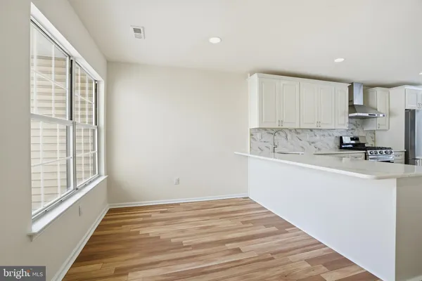 a view of kitchen with wooden floor