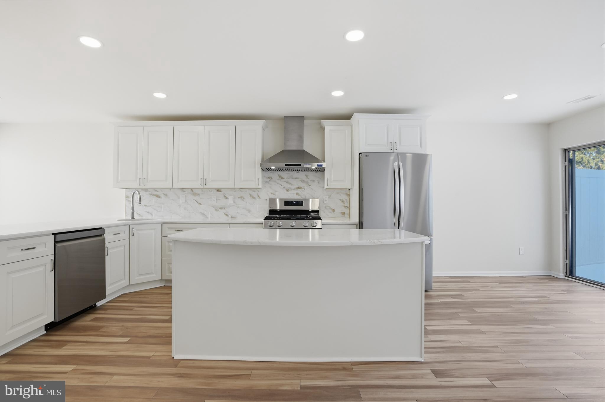 1004 Waterford Road Yardley, PA 19067 - Photo 7 of 27 a kitchen with a refrigerator and a stove top oven