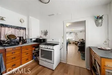 a kitchen with a stove and a sink