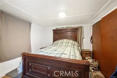 a kitchen with a table chairs refrigerator and cabinets