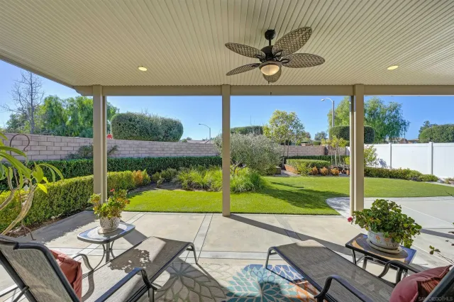 a blue bench sitting in front of a building