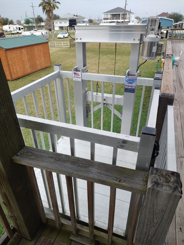 970 Wommack Drive Crystal Beach, TX 77650 - Photo 11 of 49 a view of a balcony with a chair and wooden floor