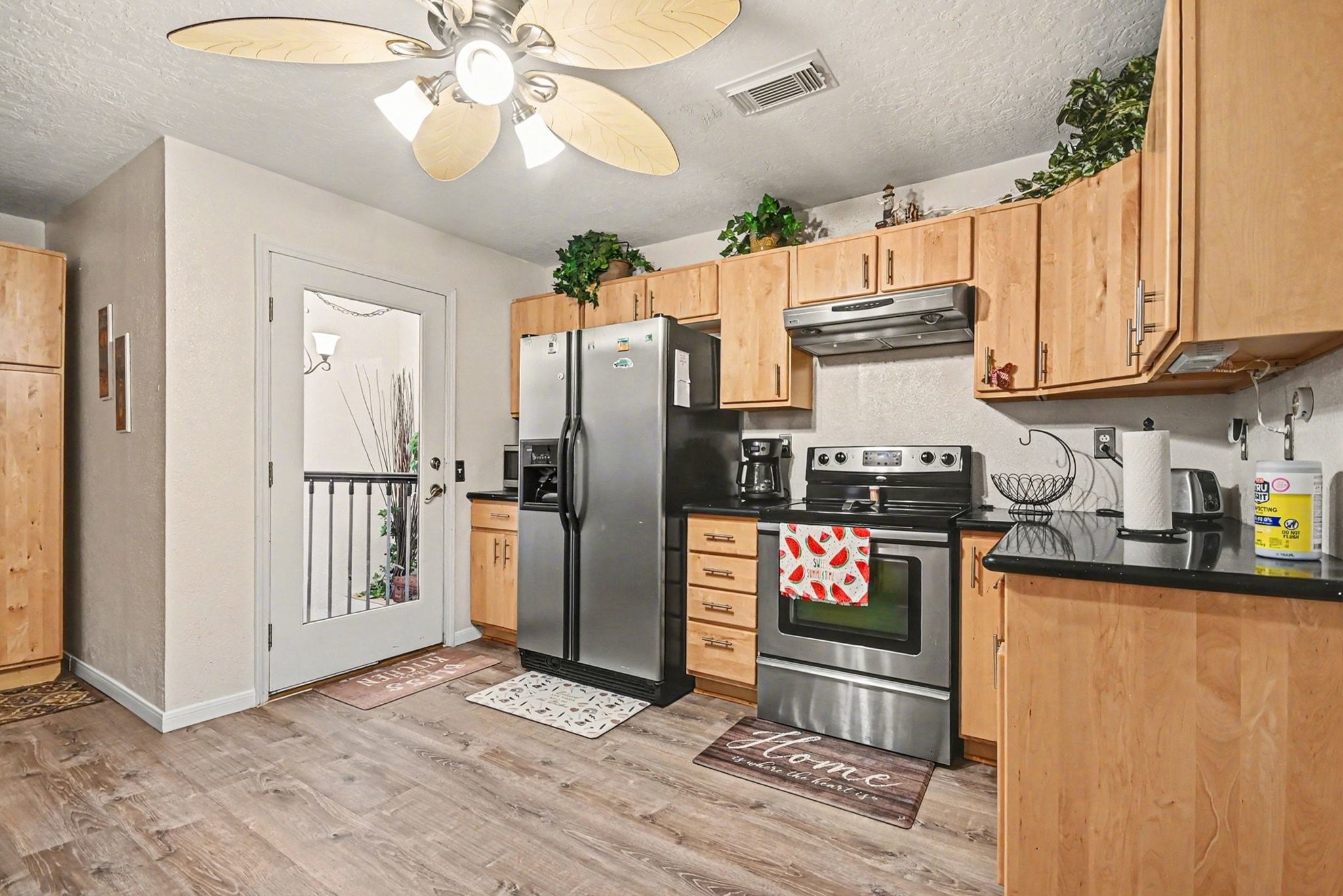 970 Wommack Drive Crystal Beach, TX 77650 - Photo 19 of 49 a kitchen with granite countertop a refrigerator oven a sink and dishwasher