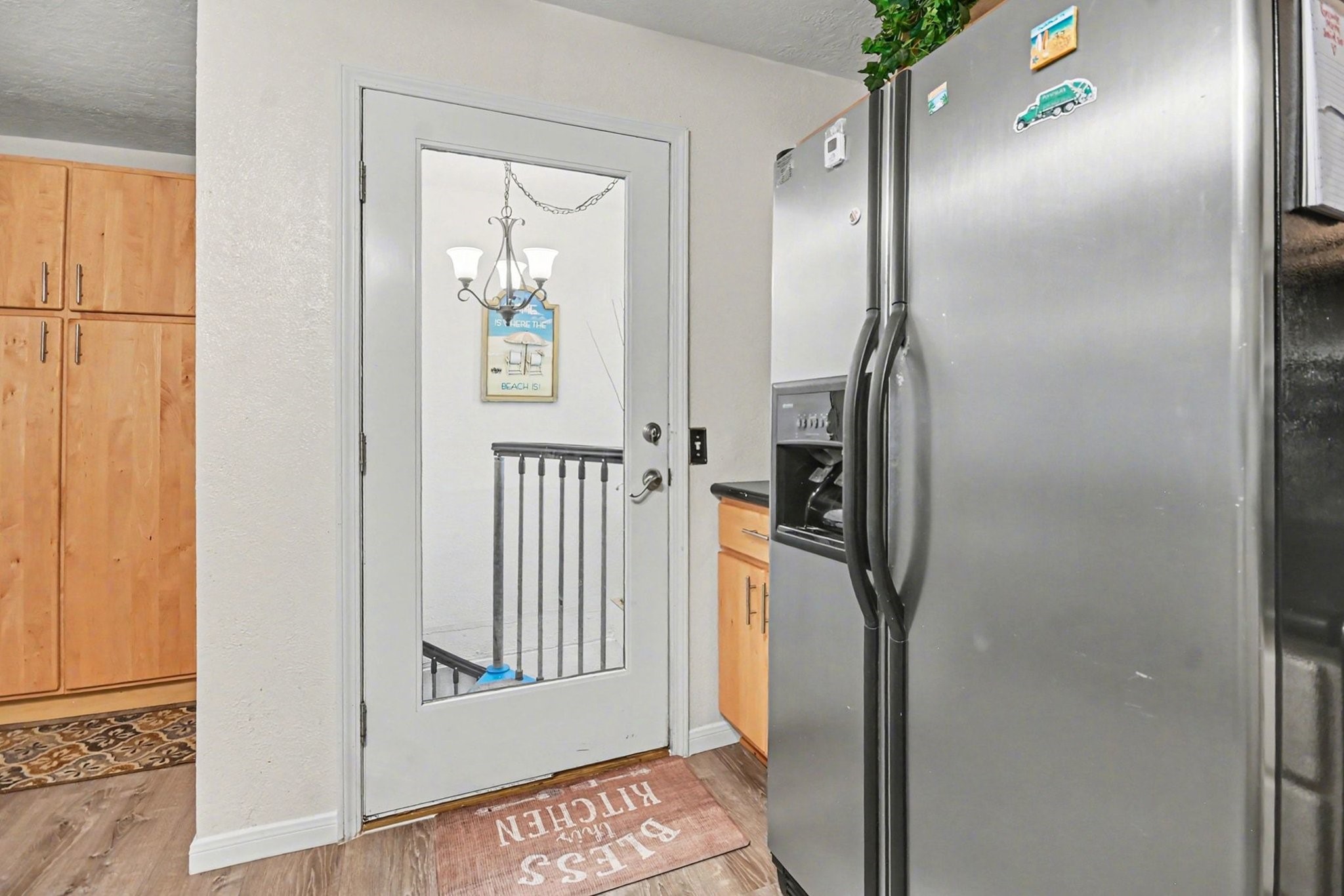 970 Wommack Drive Crystal Beach, TX 77650 - Photo 29 of 49 a view of a hallway with wooden floor and entryway