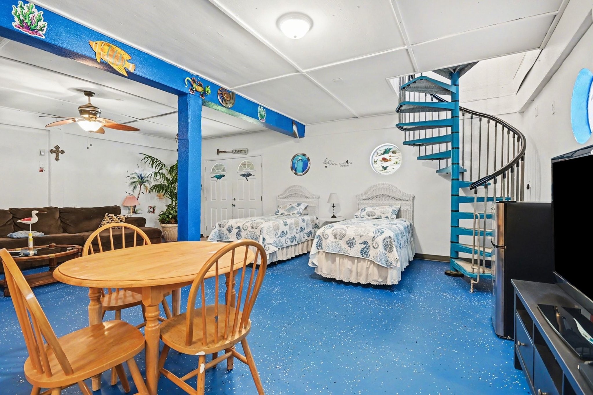 970 Wommack Drive Crystal Beach, TX 77650 - Photo 30 of 49 a bedroom with furniture and a flat screen tv