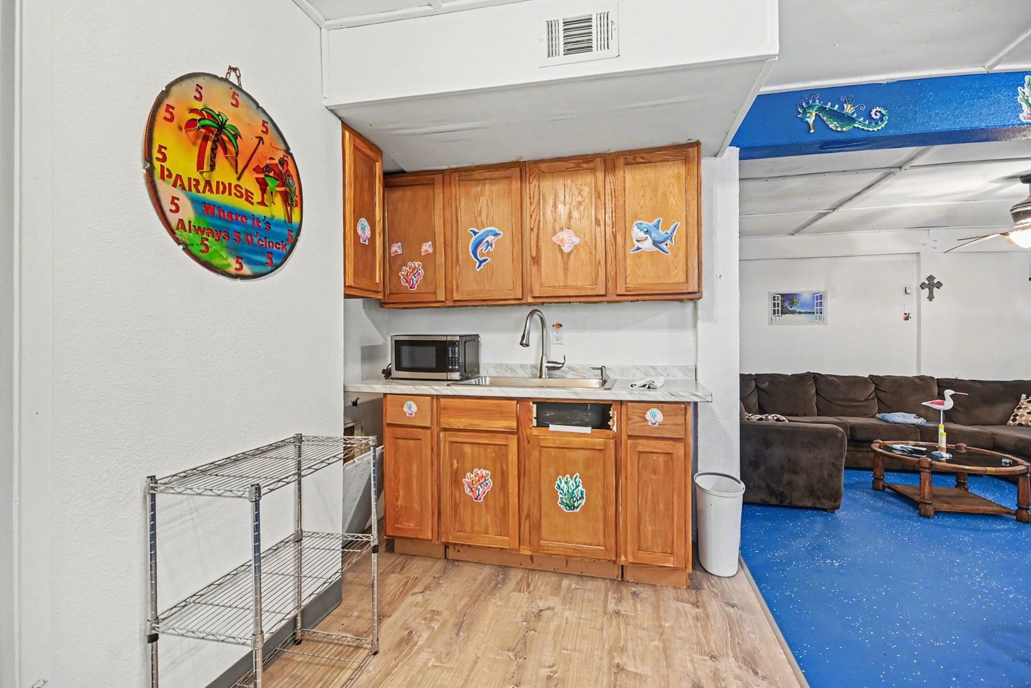 970 Wommack Drive Crystal Beach, TX 77650 - Photo 34 of 49 a kitchen with stainless steel appliances granite countertop a stove a sink and a microwave