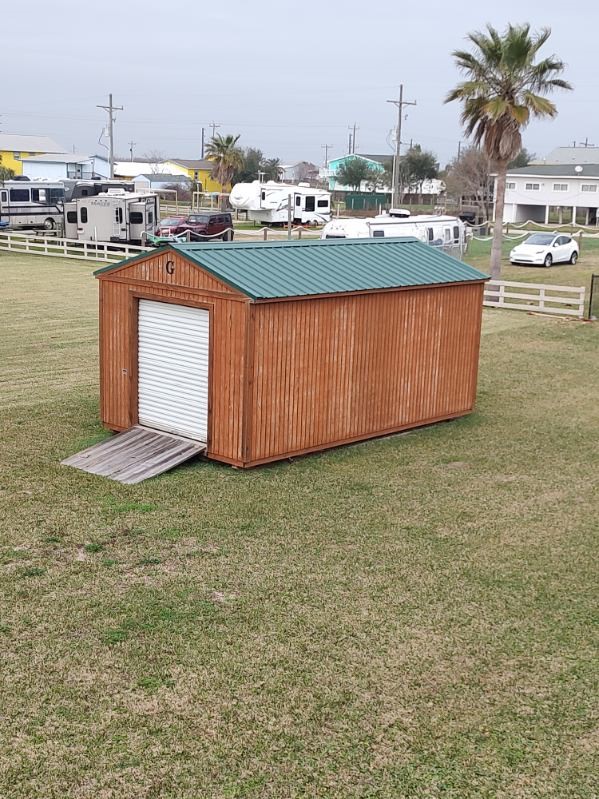 970 Wommack Drive Crystal Beach, TX 77650 - Photo 40 of 49 a swimming pool with a lawn chairs yard