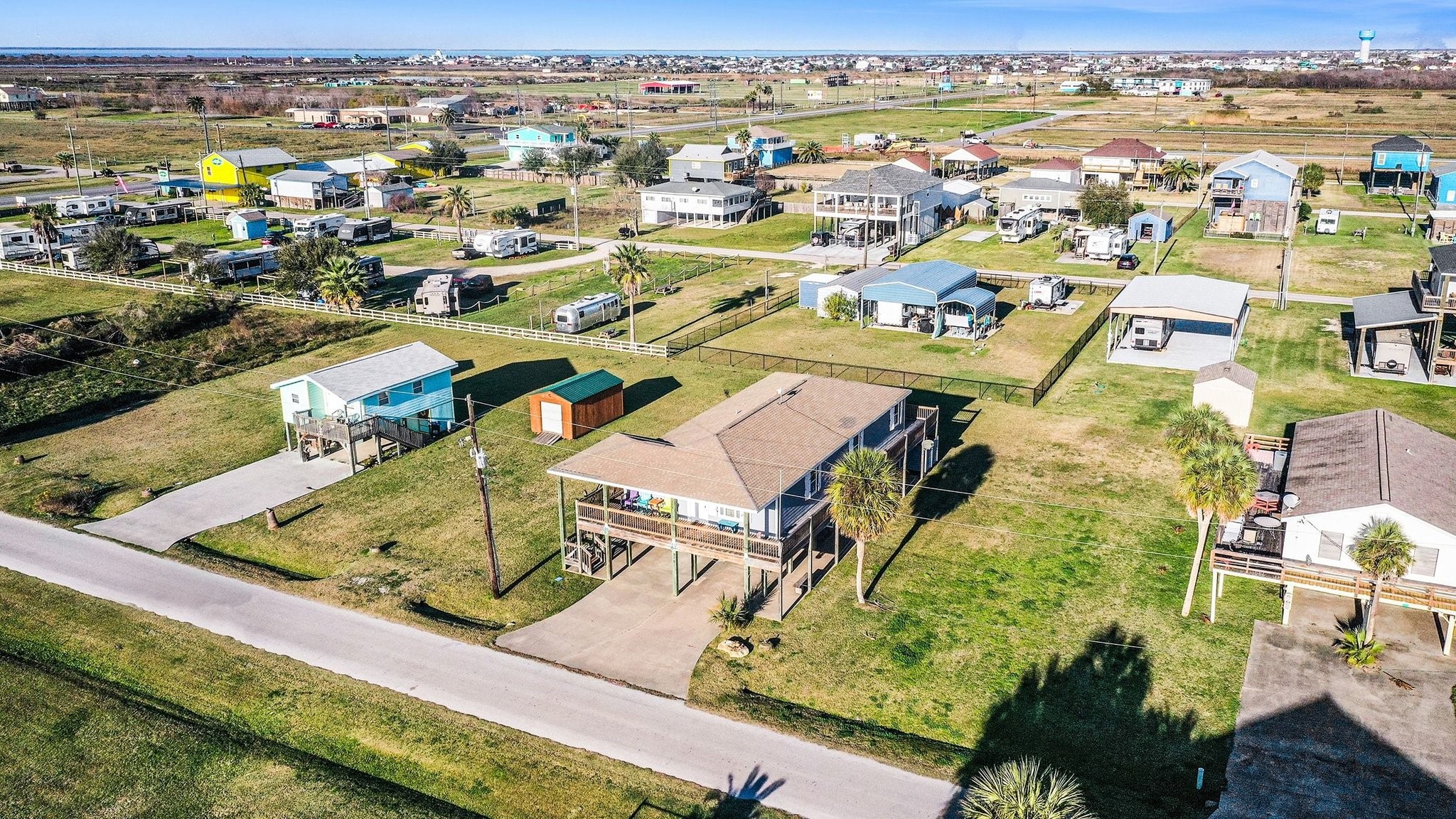970 Wommack Drive Crystal Beach, TX 77650 - Photo 42 of 49 an aerial view of residential houses with outdoor space