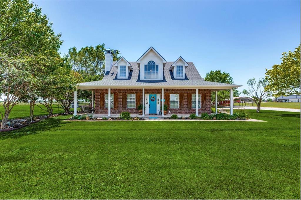 1992 Bledsoe Road Gunter, TX 75058 - Photo 2 of 40 a front view of a house with a yard
