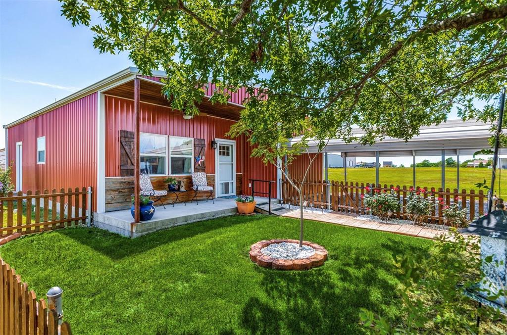 1992 Bledsoe Road Gunter, TX 75058 - Photo 25 of 40 a view of a house with backyard and porch