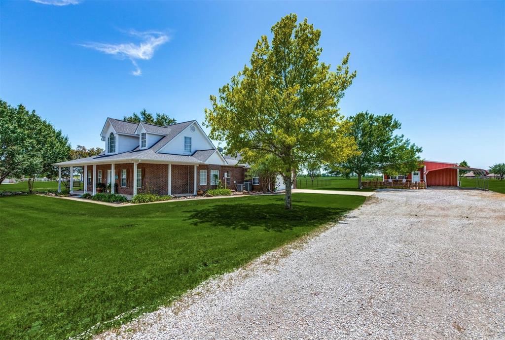 1992 Bledsoe Road Gunter, TX 75058 - Photo 3 of 40 a front view of a house with a yard