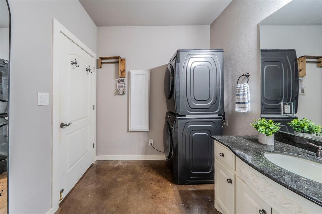 1992 Bledsoe Road Gunter, TX 75058 - Photo 32 of 40 a kitchen with refrigerator and microwave