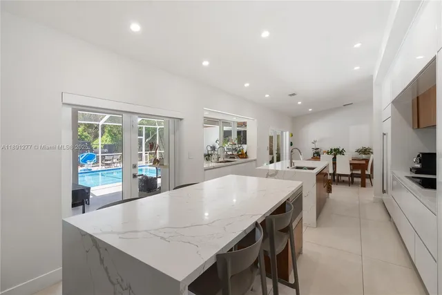 a view of a house with a backyard and a patio