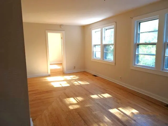 a kitchen with granite countertop white cabinets and a stove