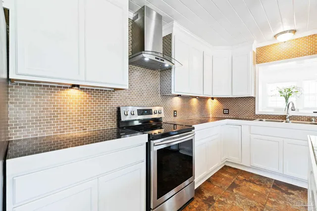 a kitchen with granite countertop a sink and a window