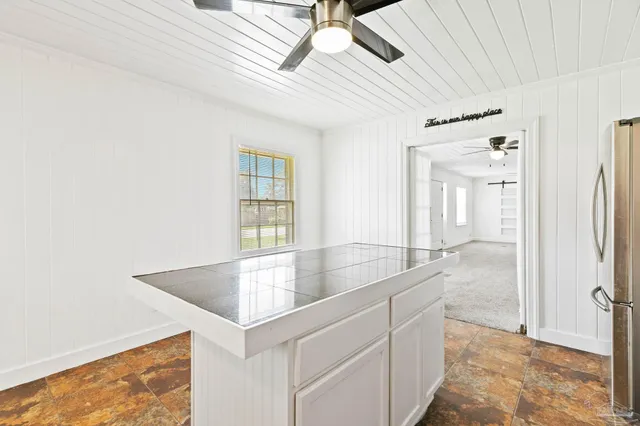 a view of a kitchen with granite countertop cabinets and a sink