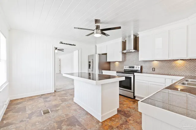 a utility room with sink dryer and washer