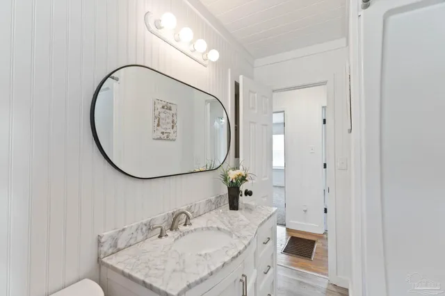 a view of an empty room and wooden floor