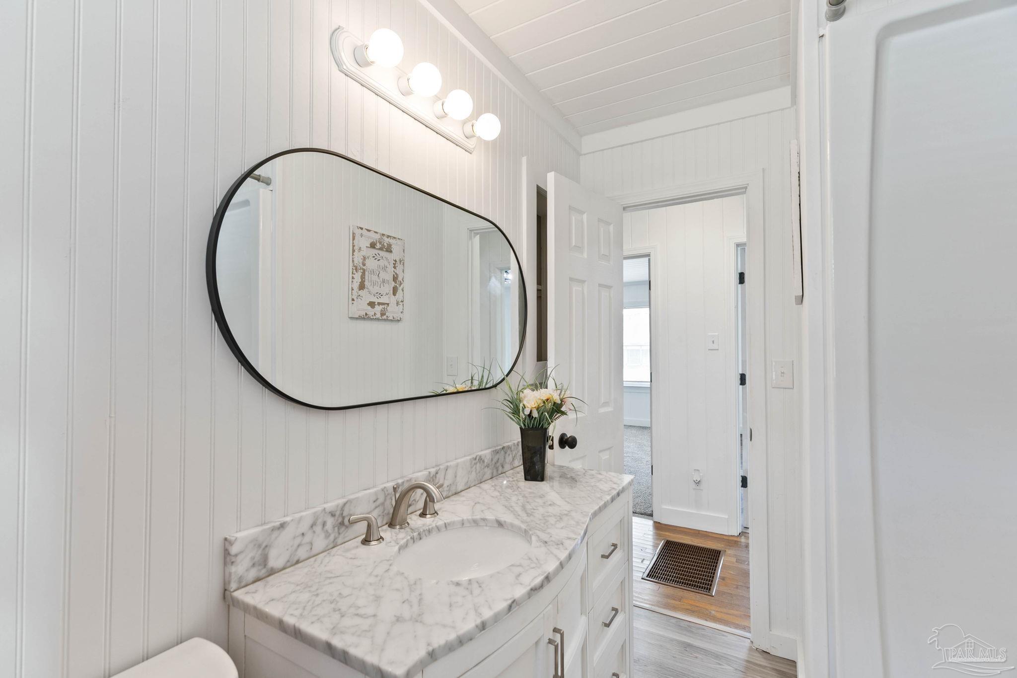 301 East Craig Street Atmore, AL 36502 - Photo 28 of 64 a bathroom with a sink and a mirror