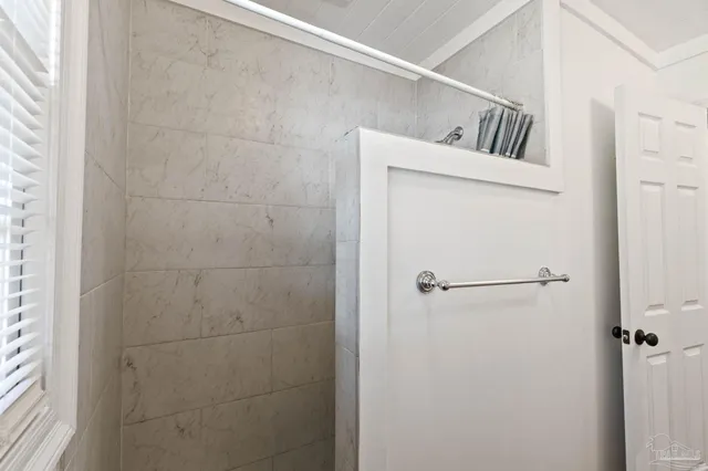 a view of a house with a backyard and a tree