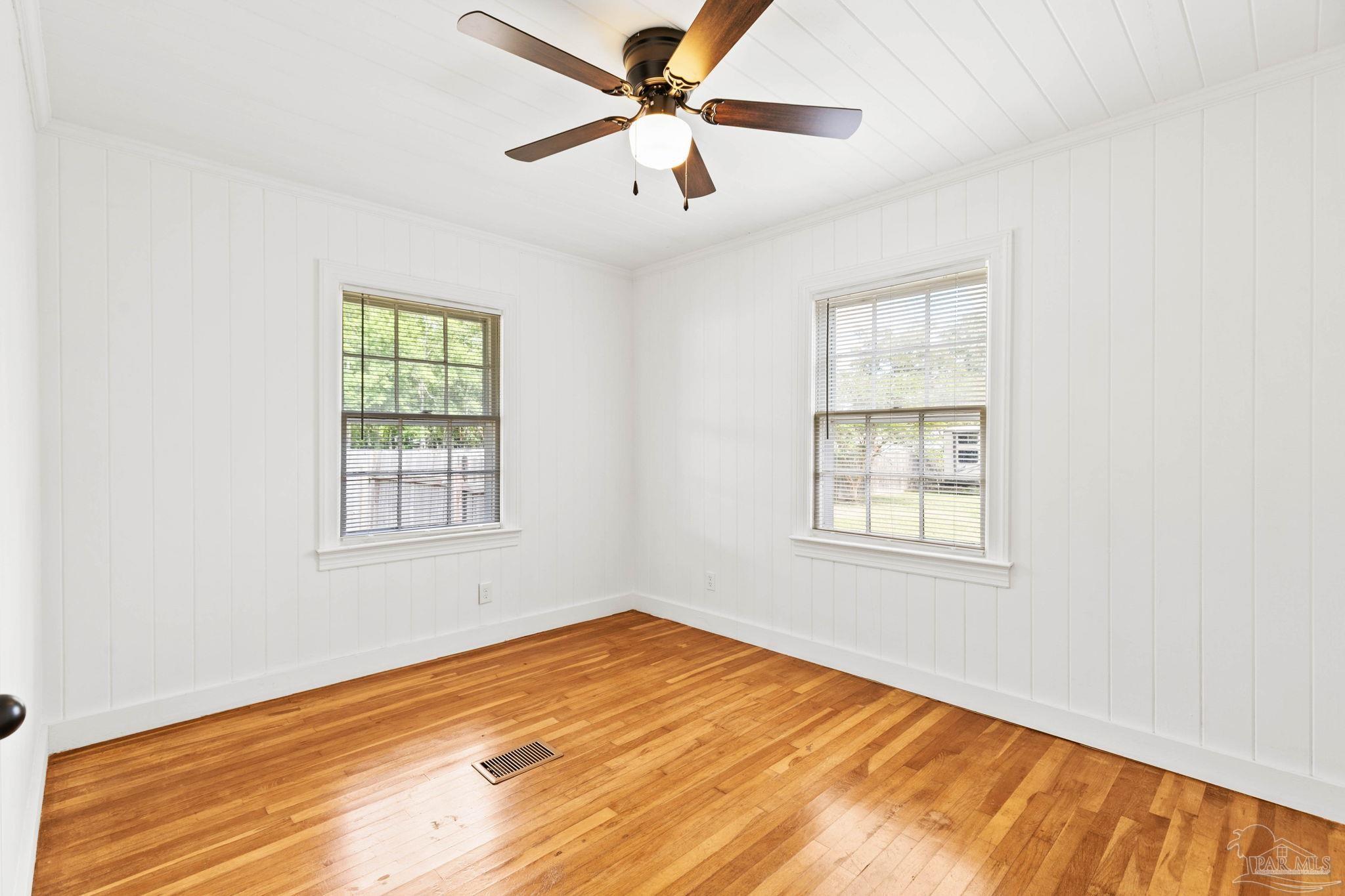 301 East Craig Street Atmore, AL 36502 - Photo 35 of 64 an empty room with windows and fan