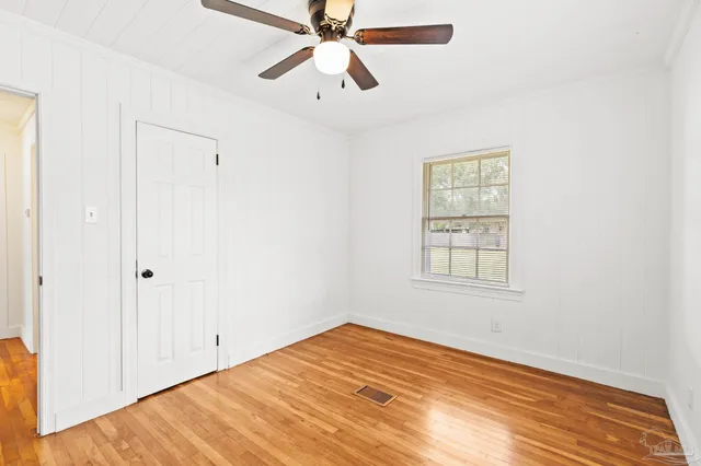 a view of a pool with an outdoor space and seating area