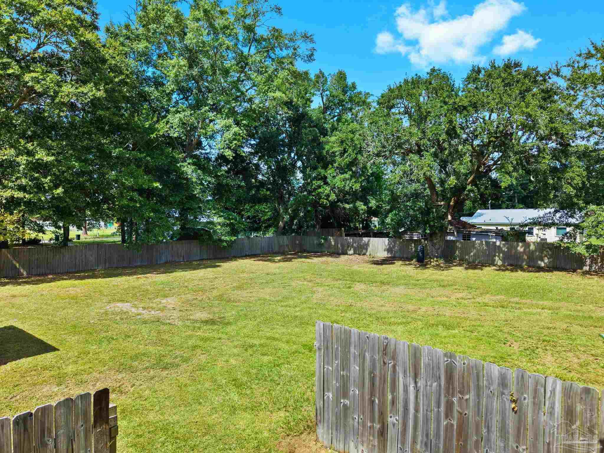 301 East Craig Street Atmore, AL 36502 - Photo 44 of 64 a view of a pool with an outdoor space and seating area