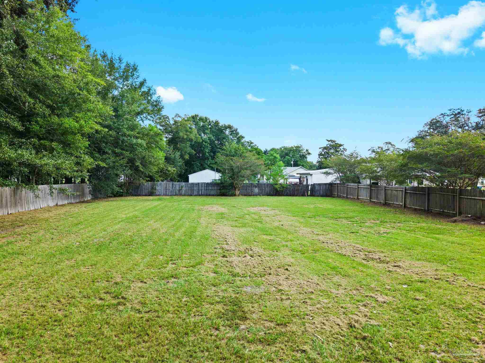 301 East Craig Street Atmore, AL 36502 - Photo 52 of 64 a view of a garden and basketball court
