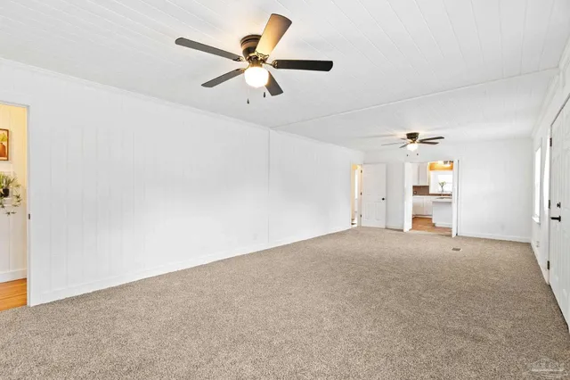 a kitchen with a sink and a refrigerator