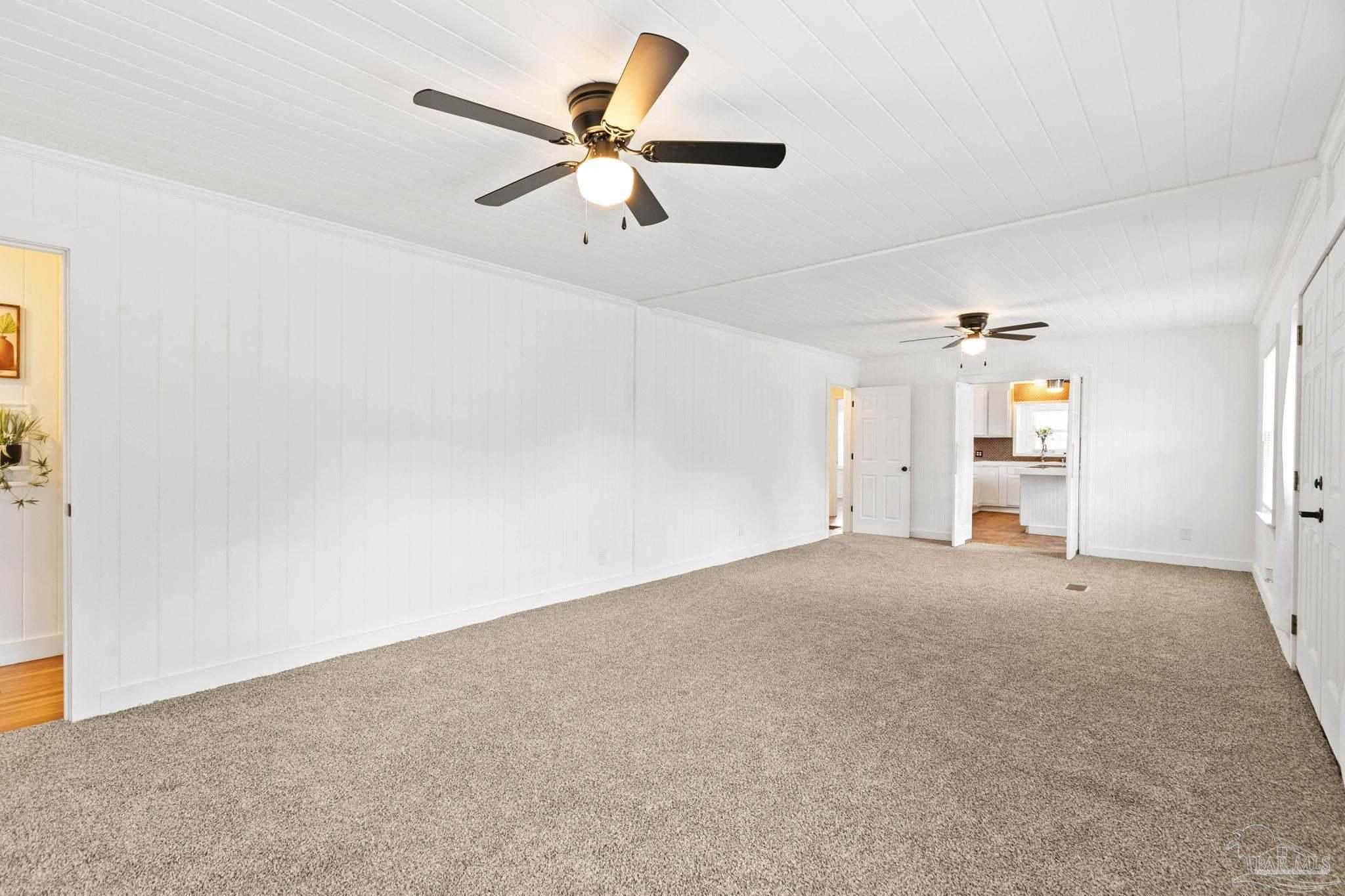 301 East Craig Street Atmore, AL 36502 - Photo 6 of 64 an empty room with a ceiling fan and window