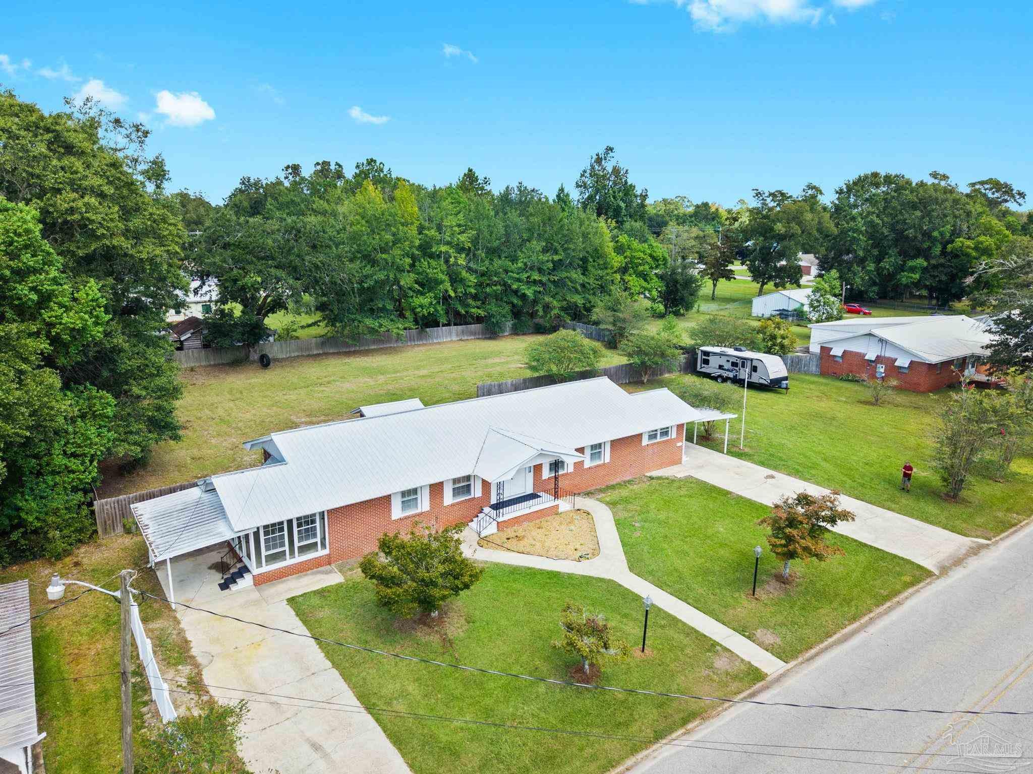 301 East Craig Street Atmore, AL 36502 - Photo 62 of 64 an aerial view of a house with swimming pool garden and outdoor seating