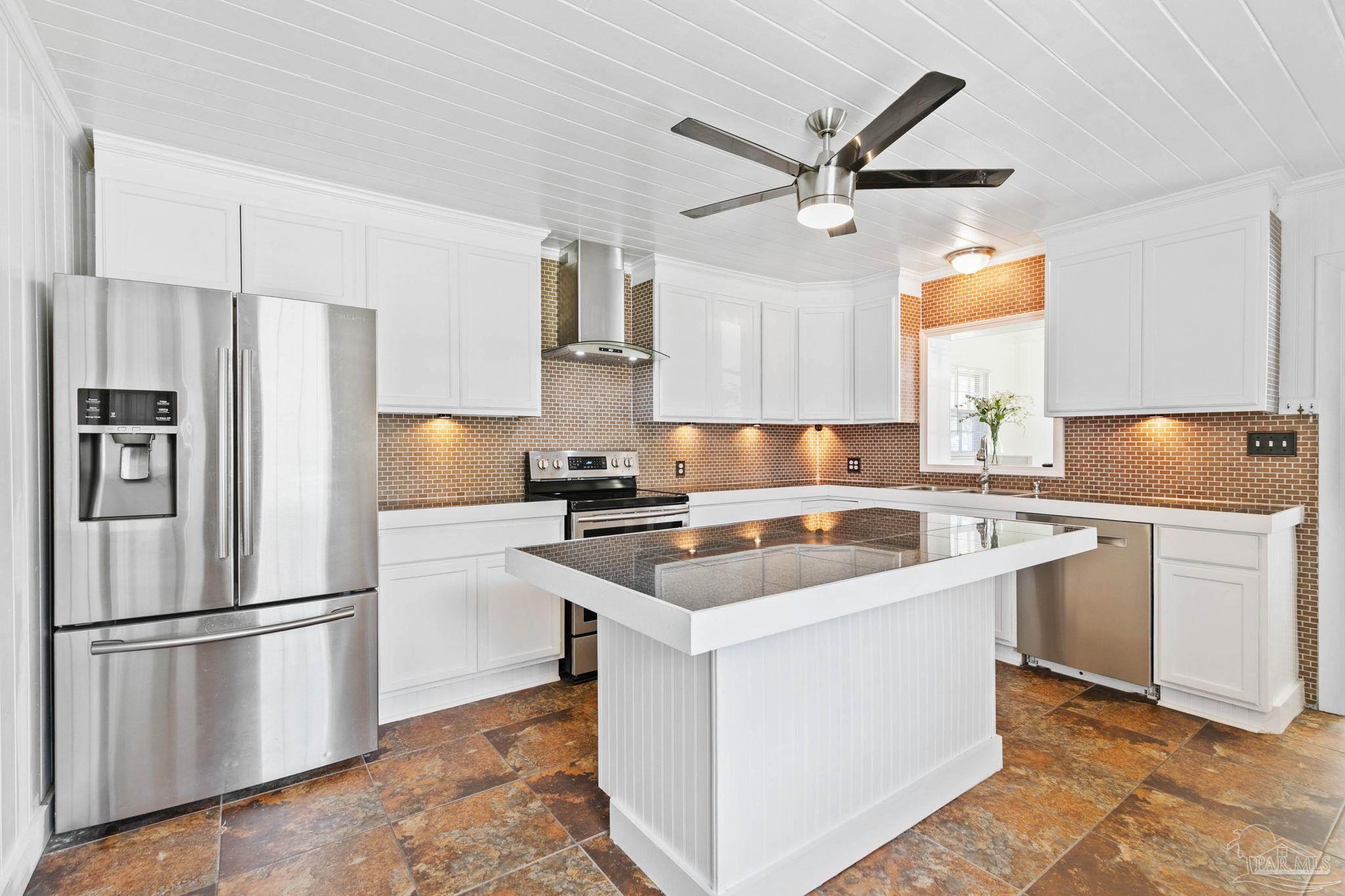 301 East Craig Street Atmore, AL 36502 - Photo 9 of 64 a kitchen with a sink stainless steel appliances and window