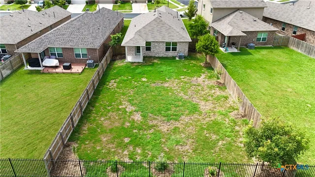 a aerial view of a house with garden