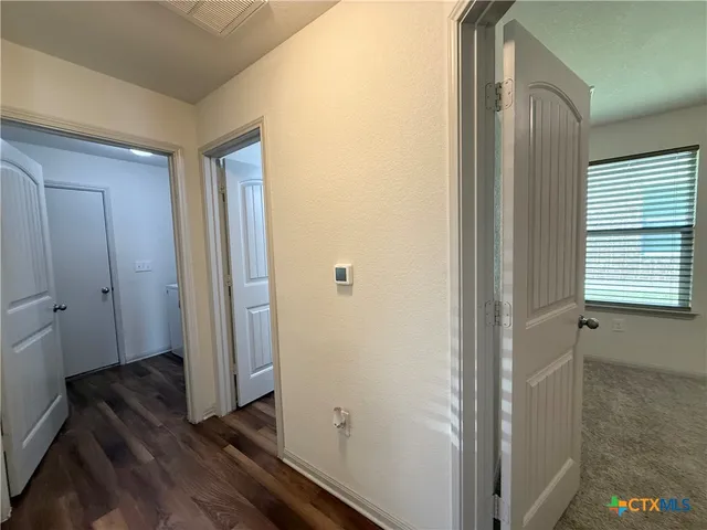 a view of a bathroom with a sink and a mirror