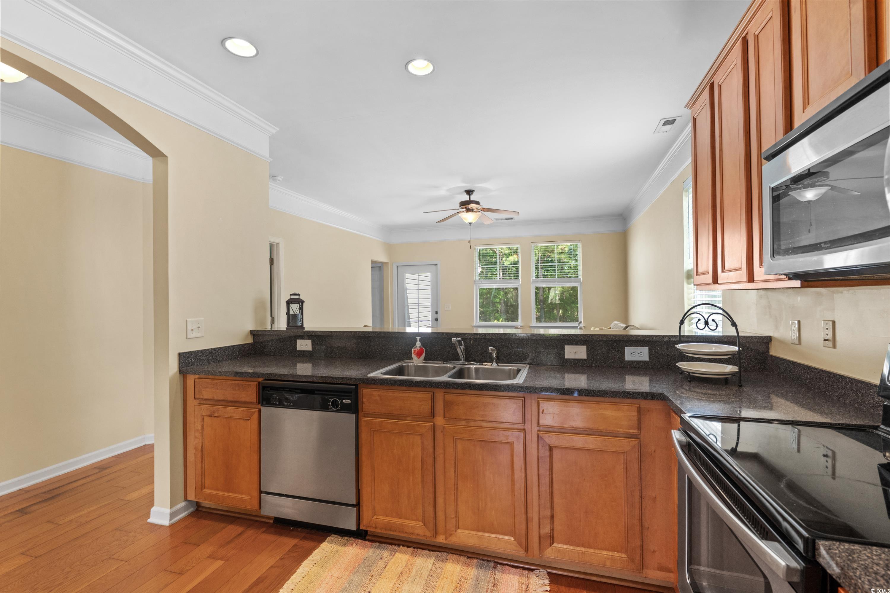 908 Oglethorpe Drive Conway, SC 29527 - Photo 16 of 40 Kitchen featuring a sink, crown molding, a ceiling