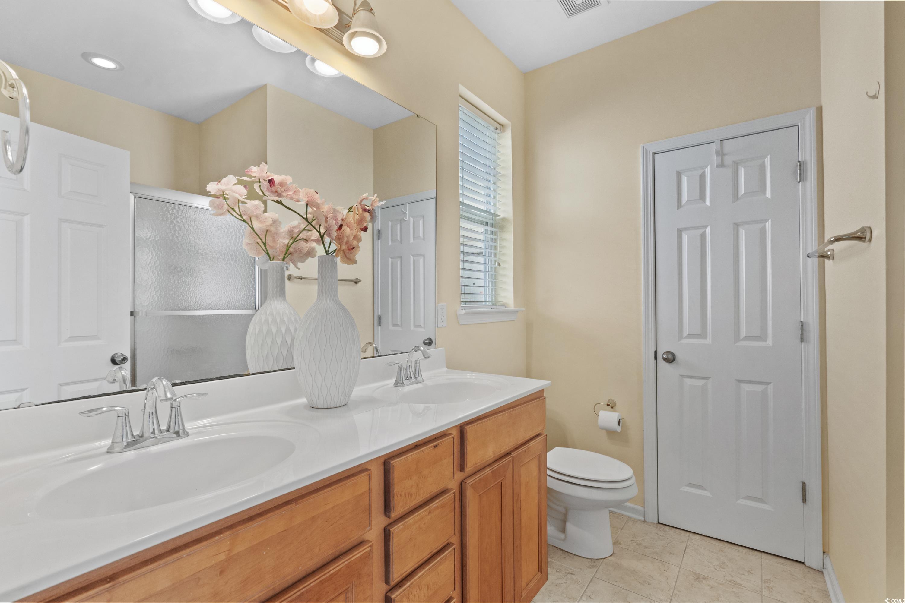 908 Oglethorpe Drive Conway, SC 29527 - Photo 20 of 40 Bathroom with double vanity, toilet, tile patterne