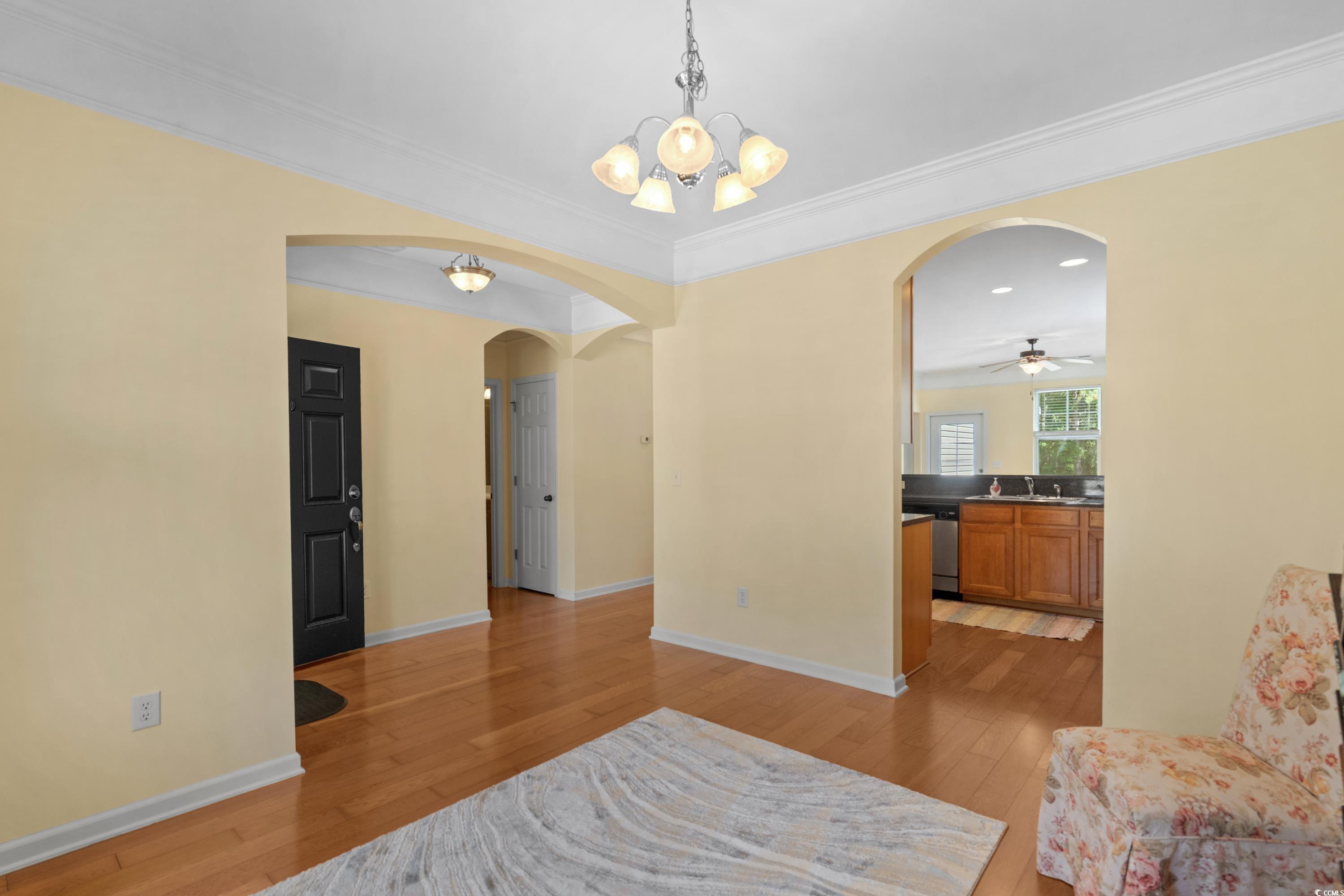 908 Oglethorpe Drive Conway, SC 29527 - Photo 7 of 40 Living area featuring crown molding, arched walkwa