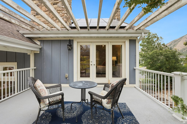 672 Perry Hollow Drive Mapleton, UT 84664 - Photo 46 of 106 just off the primary suite, deck featuring a wood pergola and white railing