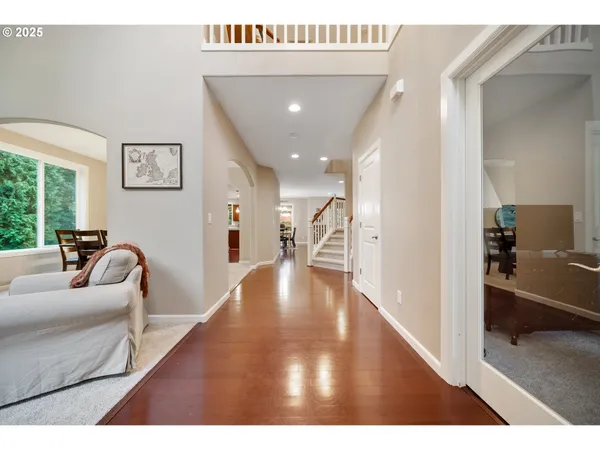 a view of a living room and a livingroom with furniture wooden floor
