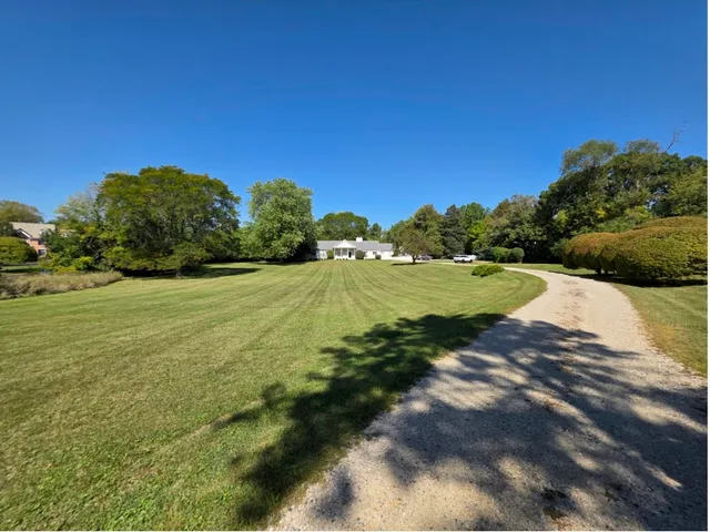 a view of a lake with houses in the background