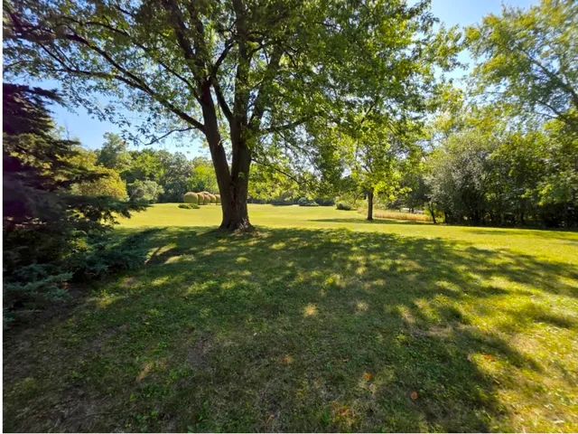 a view of outdoor space with deck and yard