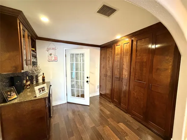 a bathroom with a granite countertop sink toilet mirror and shower
