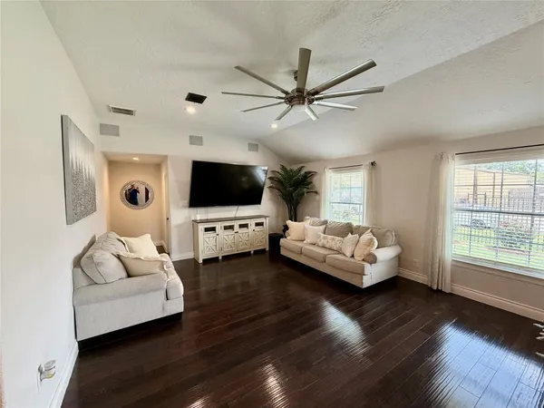 a kitchen with granite countertop stainless steel appliances a sink stove top oven and cabinets