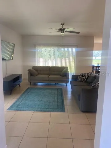 a living room with furniture and a window