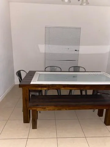 a utility room with a sink and cabinets
