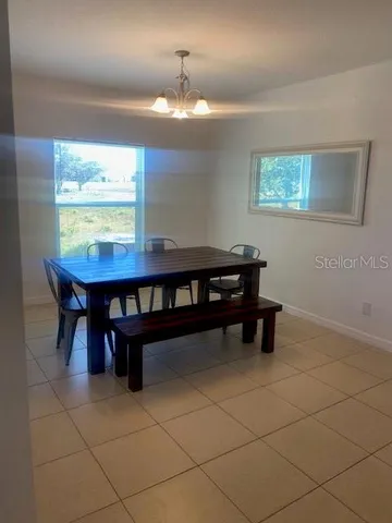 a view of a room with a table and a window