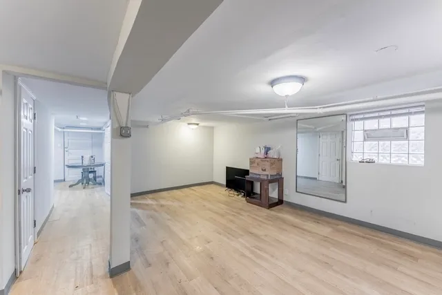 a view of a room with a furniture and a window