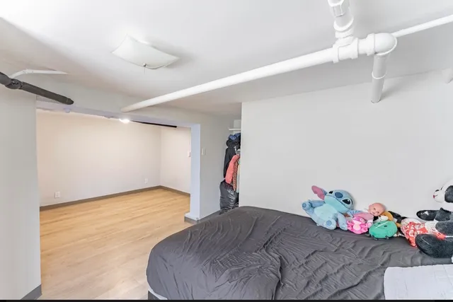 a bathroom with a sink mirror vanity and toilet
