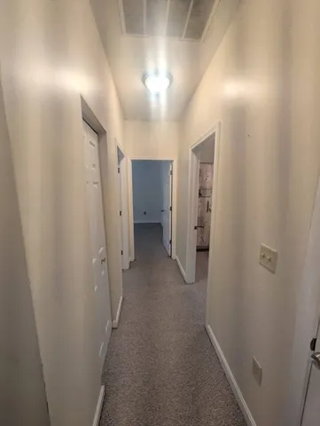 a view of hallway with closet